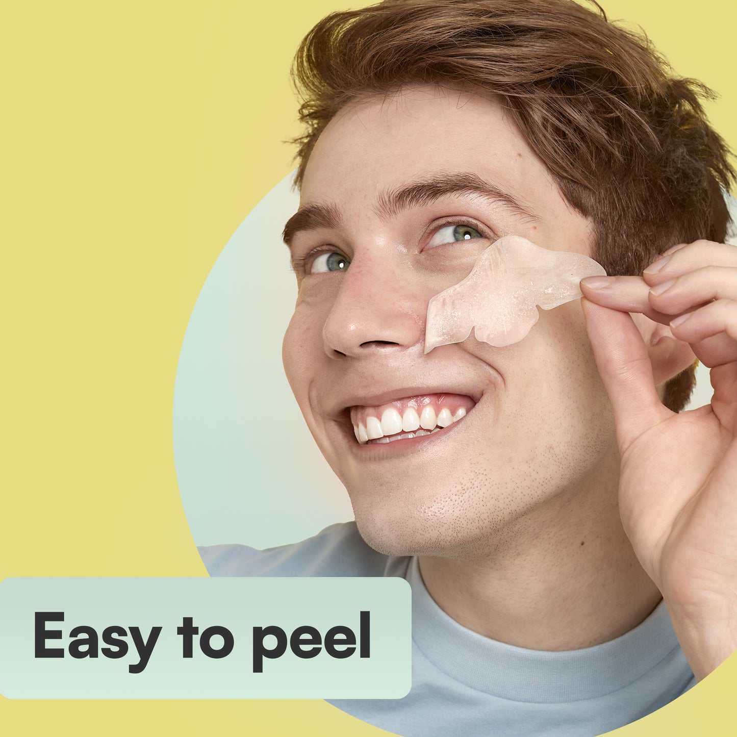Man with a satisfied expression holding a Nose Pore Patch, Easy to Peel- nose pore patches